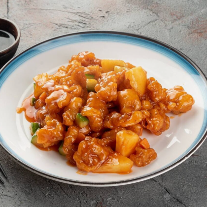 Жареная свинина с ананасом в кисло-сладком соусе  “Гулао”