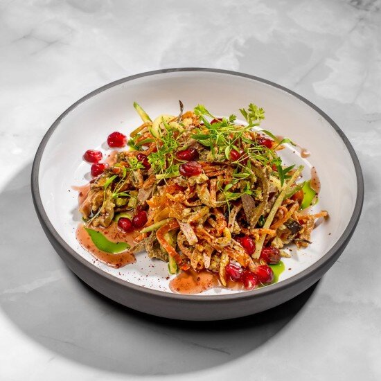 Теплый салат с языком и гранатовым соусом